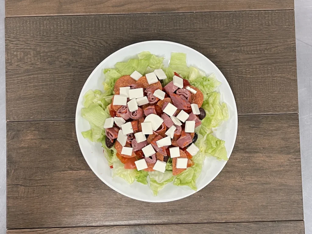 Antipasto salad with salami, capicola, pepperoni, fresh mozzarella, olives and tomato