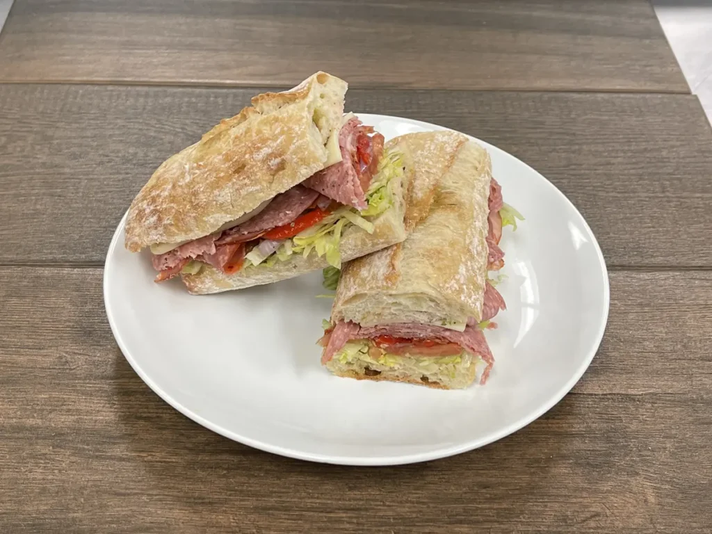 Deluxe Italian sub with capicola, genoa salami, provolone and roasted red peppers on a baguette