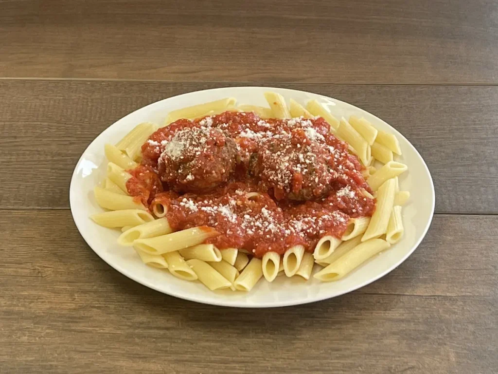 Penne with two meatballs, marinara and parmesan